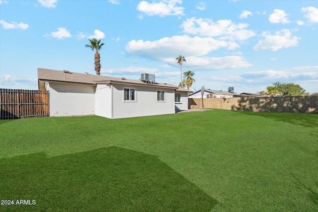 view of yard with central AC