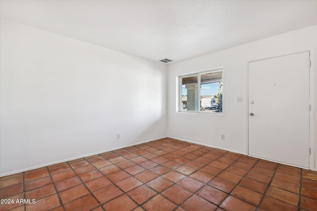 view of tiled spare room