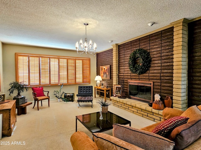 living room featuring an inviting chandelier, a textured ceiling, and a fireplace