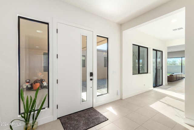 entryway featuring light tile patterned flooring