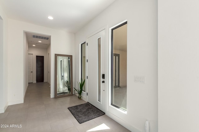 corridor with light tile patterned flooring