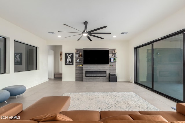 living room featuring light tile patterned floors and ceiling fan