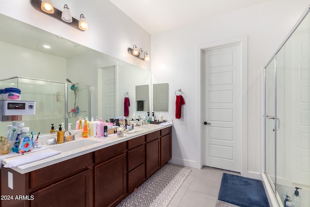 bathroom featuring vanity, tile patterned floors, and walk in shower