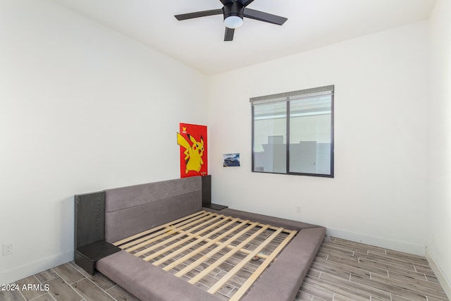 bedroom featuring light hardwood / wood-style flooring and ceiling fan