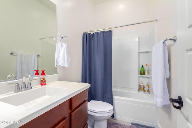 full bathroom with vanity, shower / bath combination with curtain, and toilet