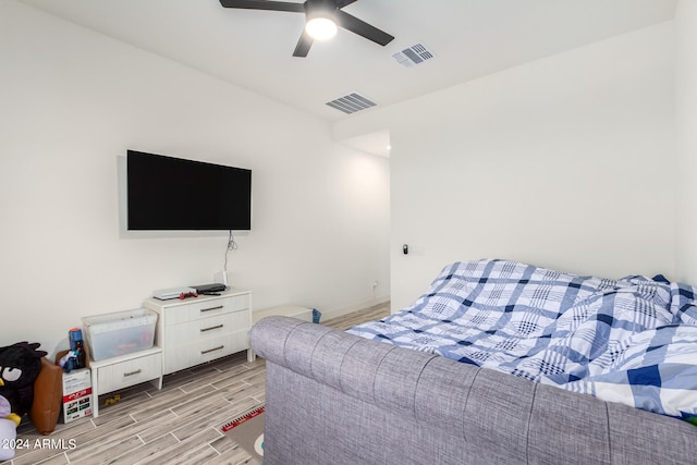 bedroom featuring light hardwood / wood-style floors and ceiling fan