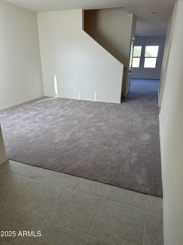 5701 E Iris Dr, Florence, AZ 85132 - carpeted spare room featuring baseboards and tile patterned floors