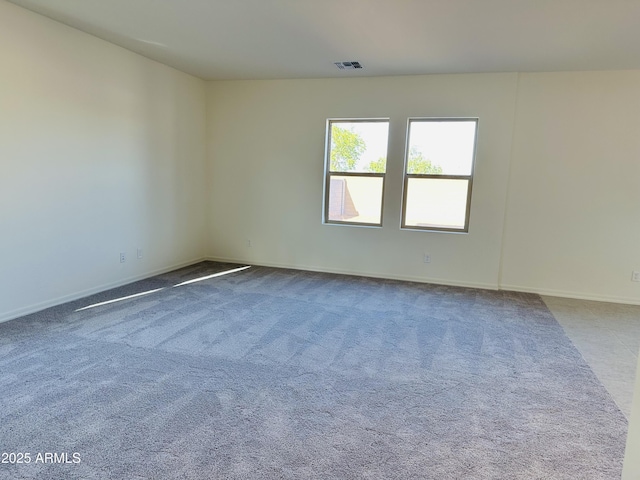 5701 E Iris Dr, Florence, AZ 85132 - carpeted spare room featuring baseboards