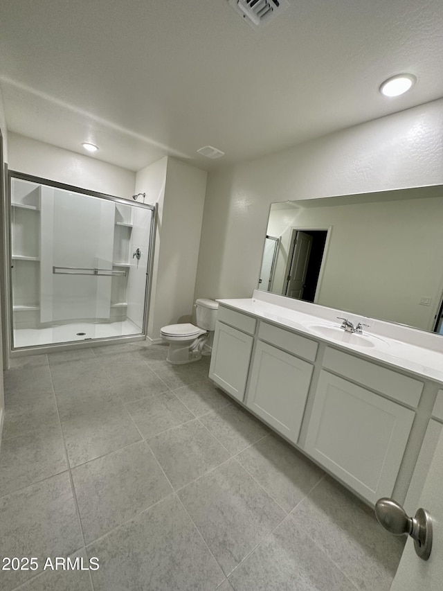 5701 E Iris Dr, Florence, AZ 85132 - full bath with a shower stall, tile patterned floors, toilet, vanity, and recessed lighting