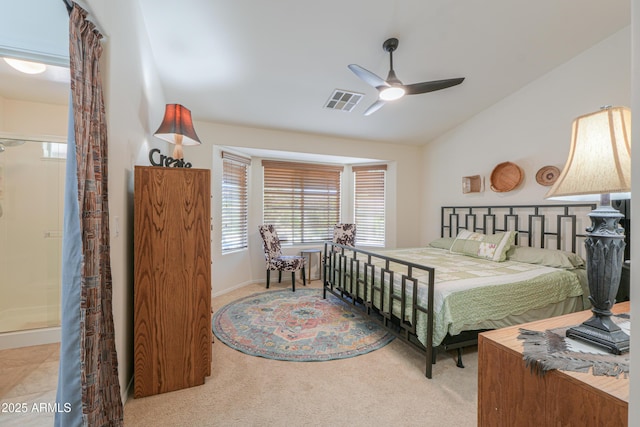 bedroom featuring visible vents, baseboards, carpet, vaulted ceiling, and a ceiling fan