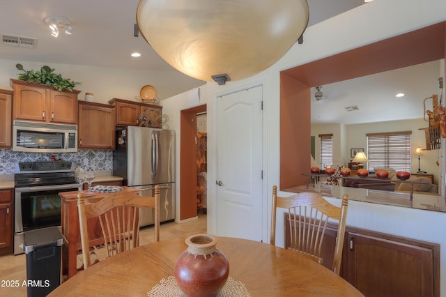 dining space featuring light tile patterned floors, visible vents, and recessed lighting