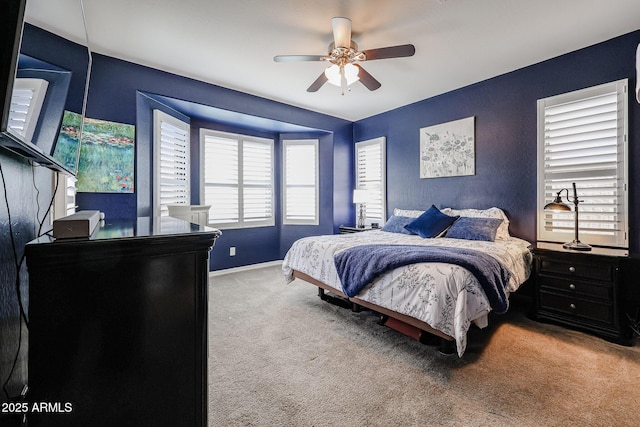 bedroom featuring ceiling fan and carpet floors