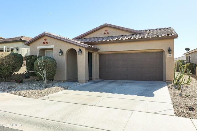 mediterranean / spanish house featuring a garage