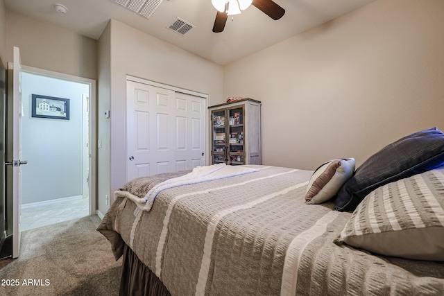 carpeted bedroom featuring a closet and ceiling fan