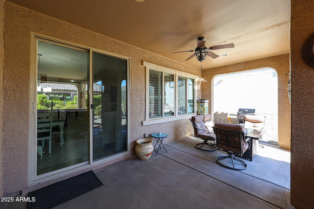 view of patio featuring ceiling fan