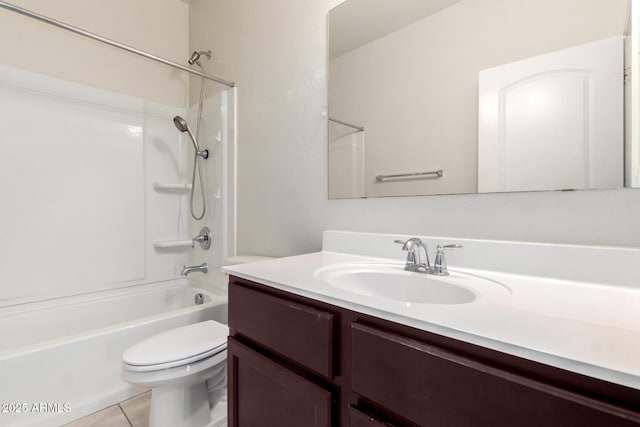 full bathroom with tile patterned floors, washtub / shower combination, toilet, and vanity