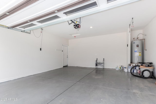 garage with electric water heater and a garage door opener