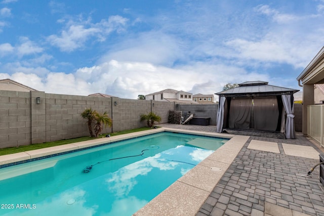 view of pool featuring a gazebo, a patio area, a fenced backyard, and a fenced in pool