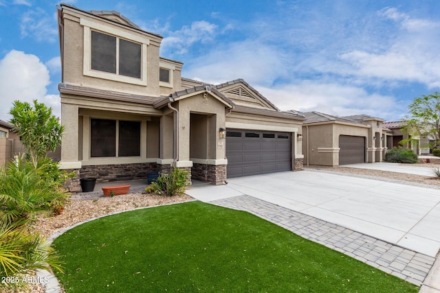 view of front of house featuring a front lawn, concrete driveway, stucco siding, stone siding, and an attached garage