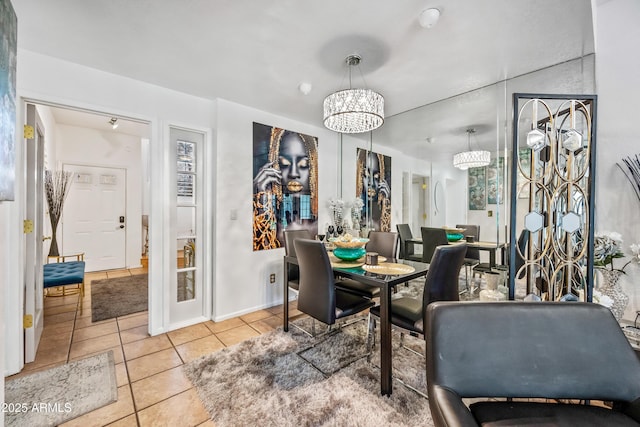 dining room featuring tile patterned floors and a chandelier