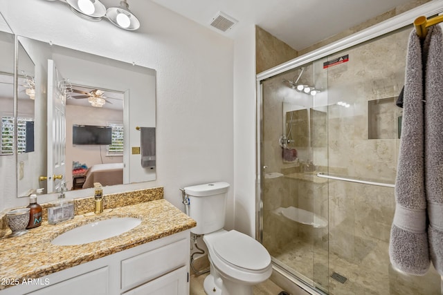 ensuite bathroom with visible vents, toilet, ensuite bathroom, ceiling fan, and vanity