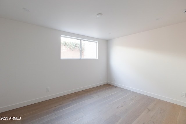 unfurnished room featuring light hardwood / wood-style flooring