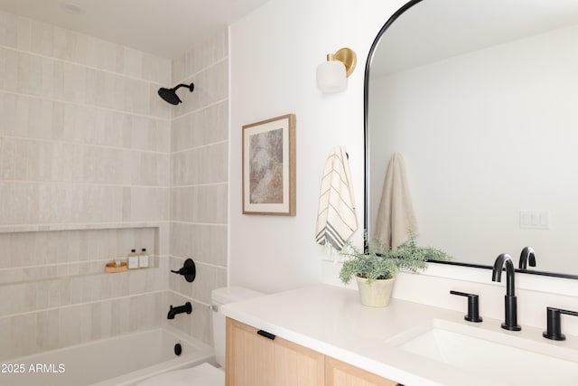 bathroom with vanity and tiled shower / bath combo