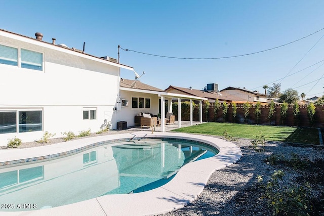 view of pool featuring central AC, a lawn, and a patio area