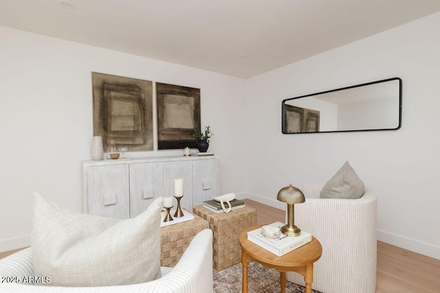 sitting room with light hardwood / wood-style flooring