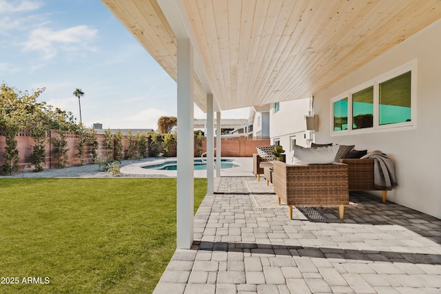 view of patio / terrace featuring a fenced in pool and an outdoor hangout area