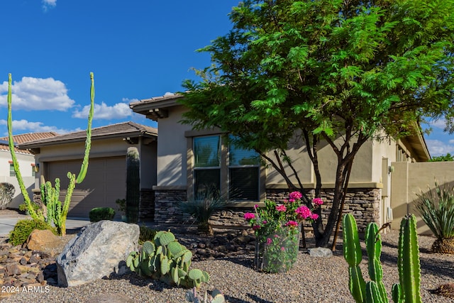 view of property exterior featuring a garage