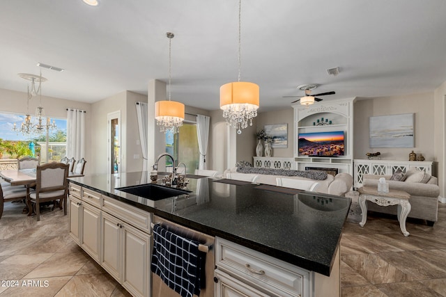 kitchen with dishwasher, sink, decorative light fixtures, a kitchen island with sink, and ceiling fan with notable chandelier