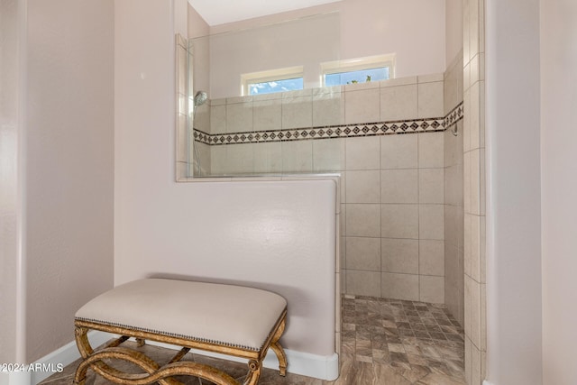 bathroom with a tile shower