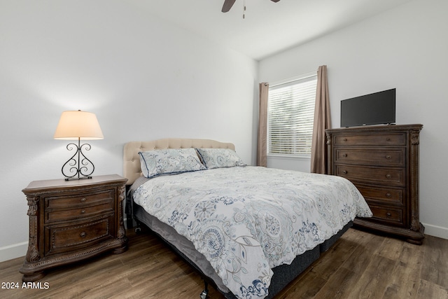 bedroom featuring dark hardwood / wood-style floors and ceiling fan