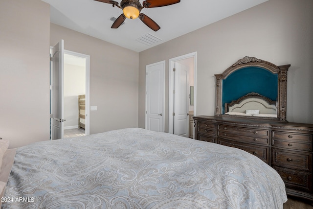 bedroom featuring ceiling fan and connected bathroom