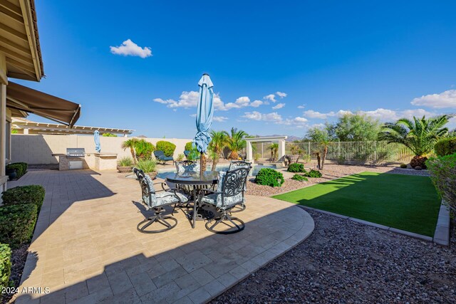 patio terrace at dusk featuring a fire pit