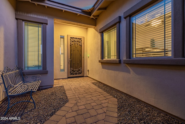 entrance to property with a patio