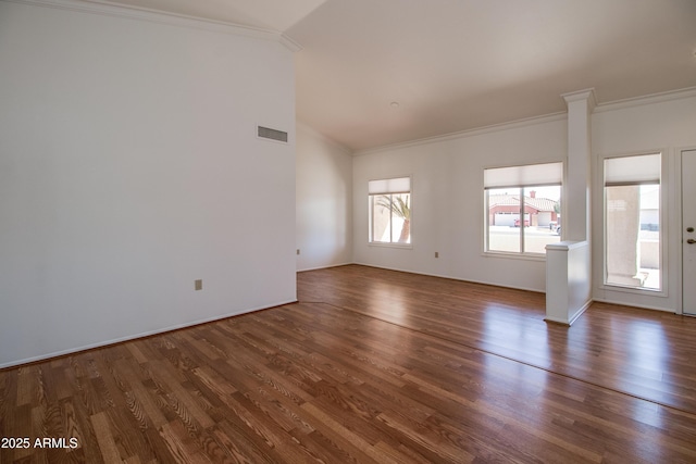 unfurnished living room featuring dark wood-type flooring, visible vents, and crown molding