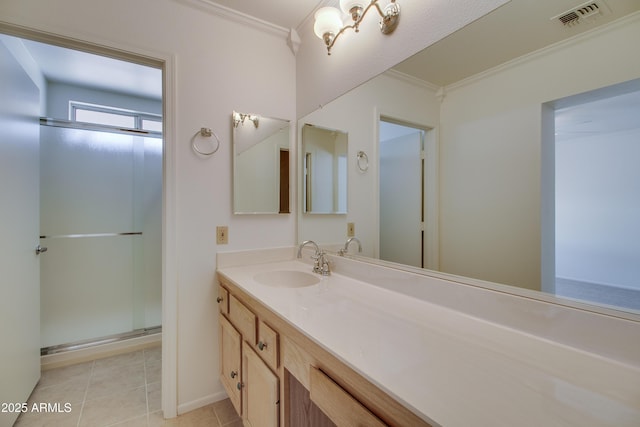 full bath featuring visible vents, ornamental molding, tile patterned floors, vanity, and a shower stall