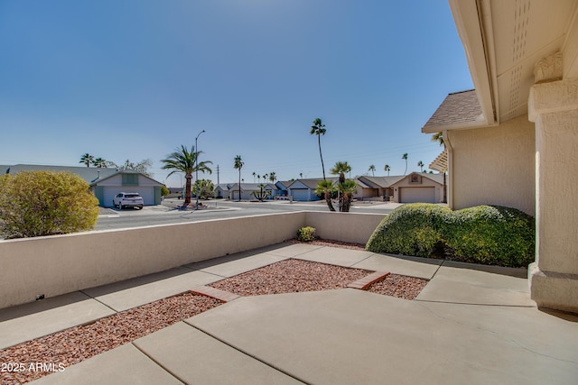 view of patio with a residential view