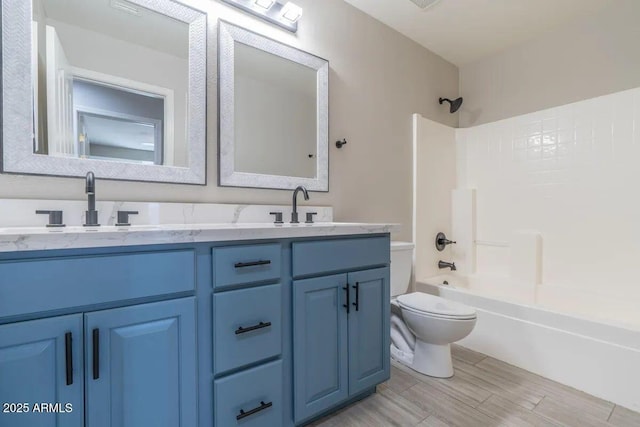 29891 N Desert Angel Dr, San Tan Valley, AZ 85143 - full bath featuring toilet, double vanity, shower / bath combination, and wood finished floors