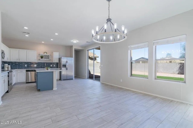29891 N Desert Angel Dr, San Tan Valley, AZ 85143 - kitchen with stainless steel appliances, a chandelier, light countertops, open floor plan, and recessed lighting