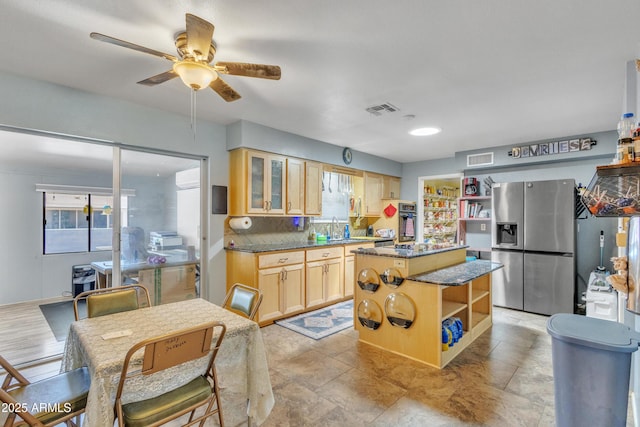 kitchen with ceiling fan, visible vents, open shelves, stainless steel fridge, and light brown cabinets