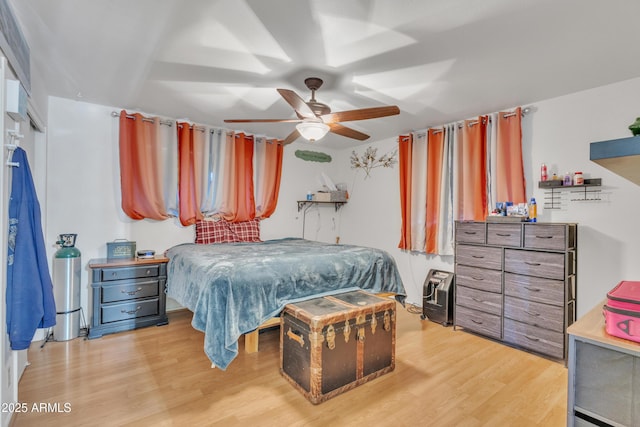 bedroom featuring ceiling fan and light wood finished floors