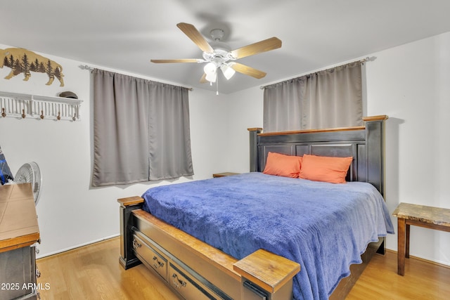 bedroom featuring a ceiling fan and wood finished floors