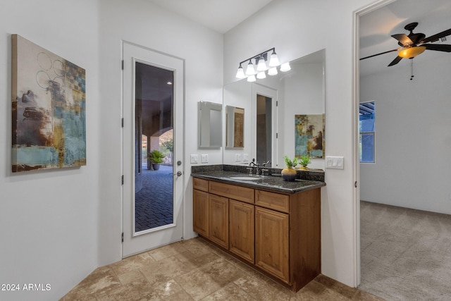 bathroom featuring vanity and ceiling fan