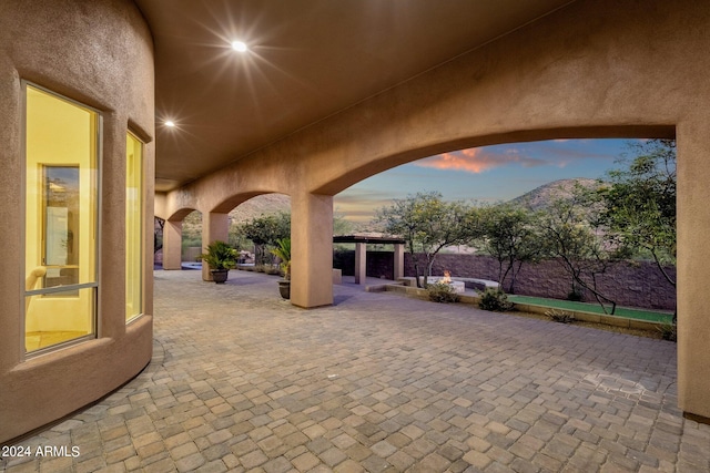 patio terrace at dusk with a mountain view