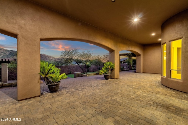 view of patio terrace at dusk