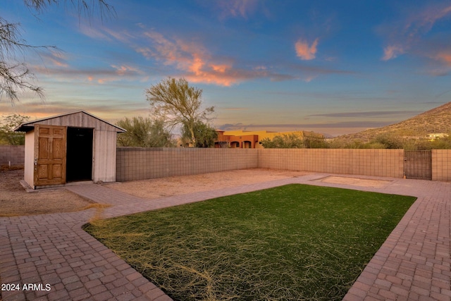 yard at dusk with a shed