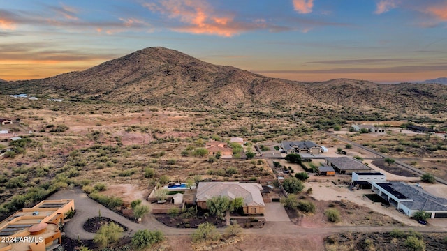 aerial view at dusk with a mountain view